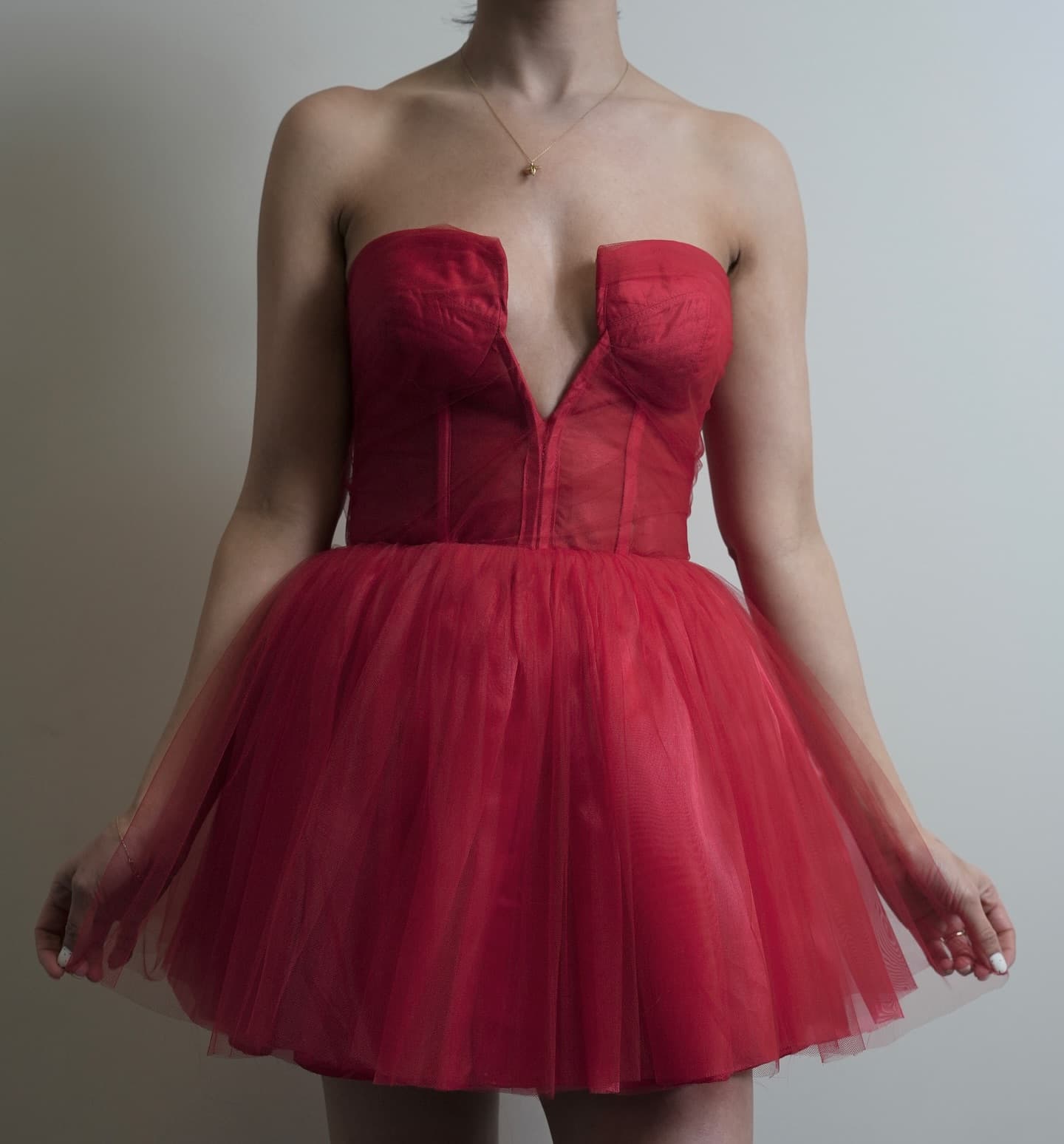 Red dress with a sculpted bodice and full skirt